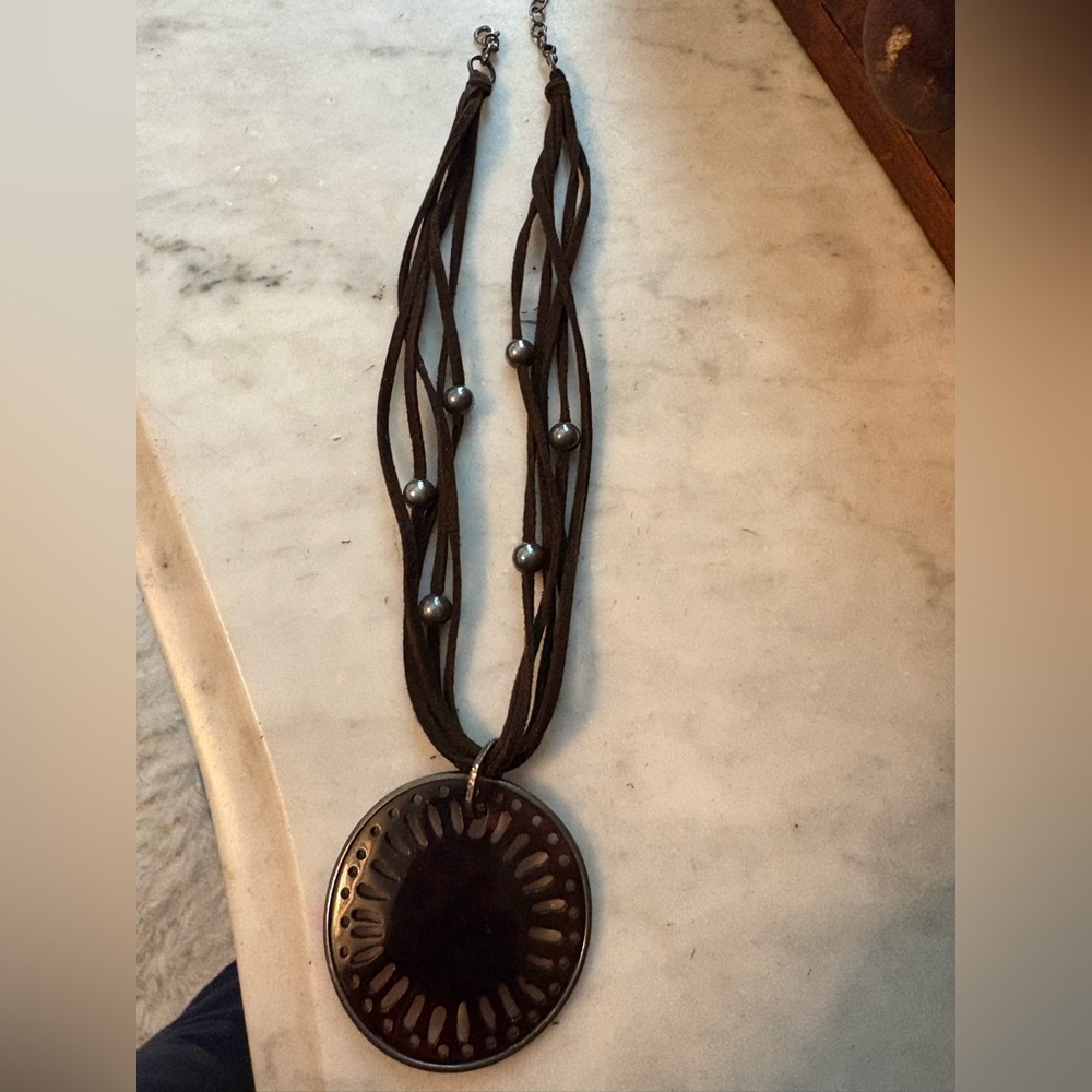 Silpada shell necklace with suede cord and silver beads scattered through